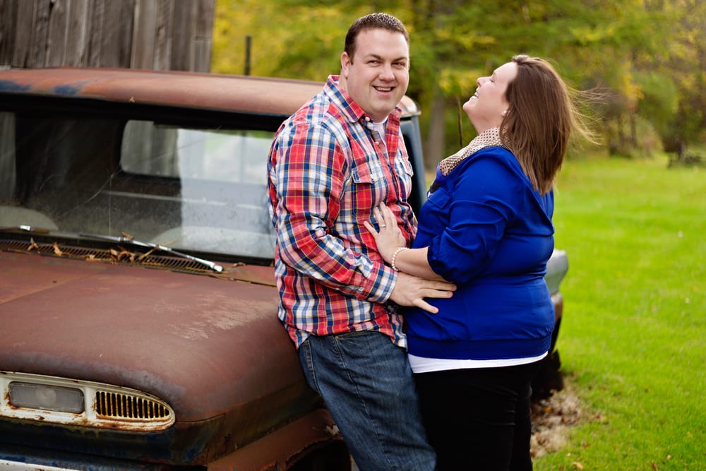 Cornwall Engagement Session - man in red shirt leaning on car