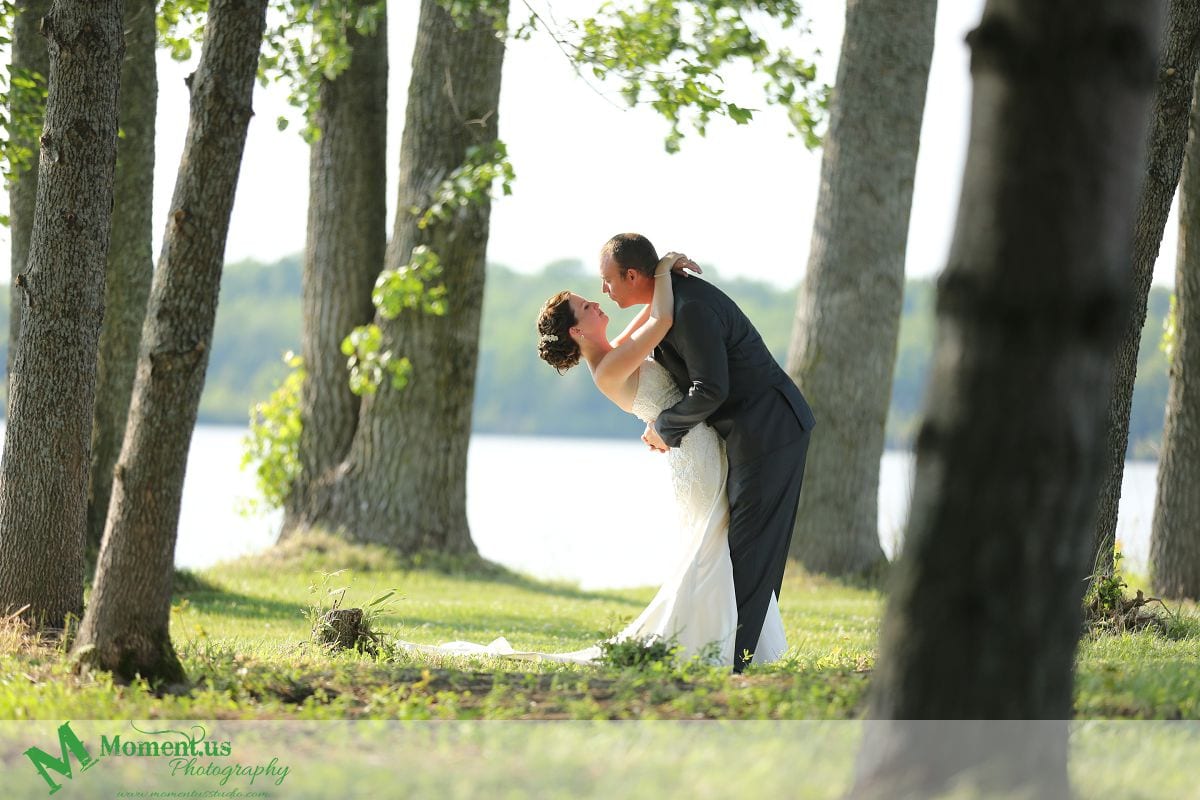 Outdoor Cornwall Wedding - groom trying to kiss bride