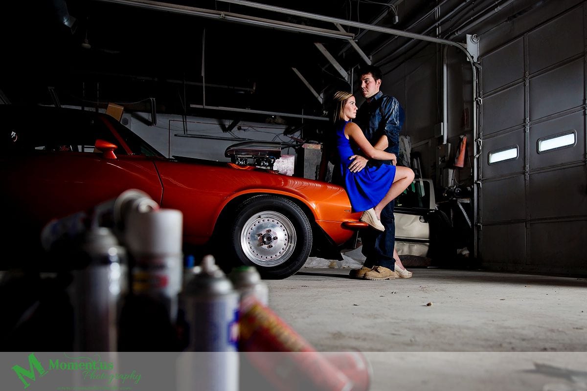 woman in blue dress sitting on hotrod - Cornwall engagement session