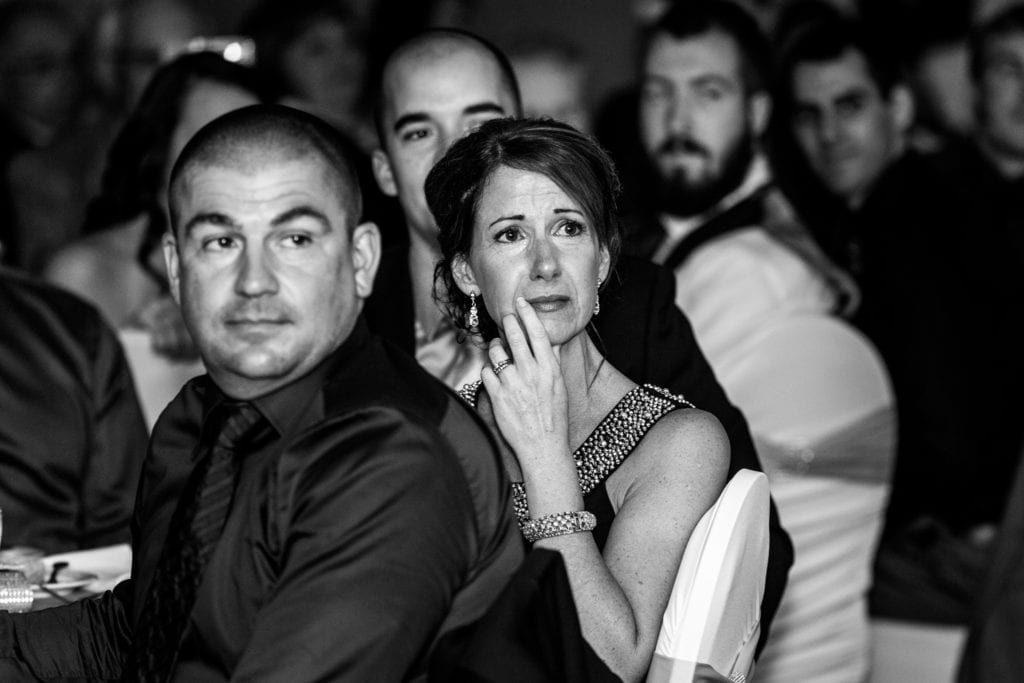 woman crying with hand to her face during NAVCan Cornwall wedding