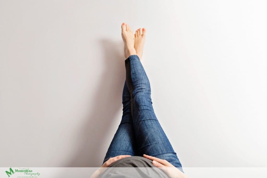 Maternity photography in Cornwall -  feet on white wall