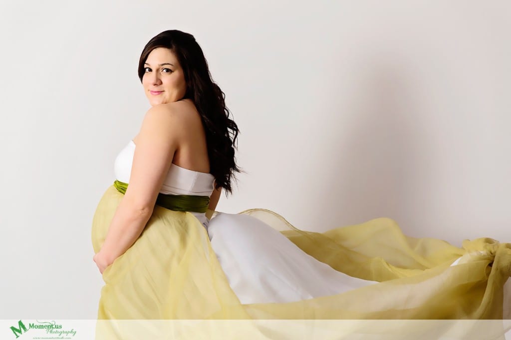 Maternity photography in Cornwall - woman in green and white dress