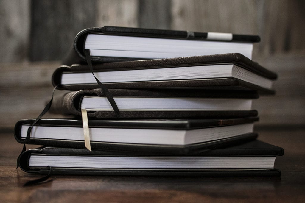 stack of Modern Ontario Wedding Albums