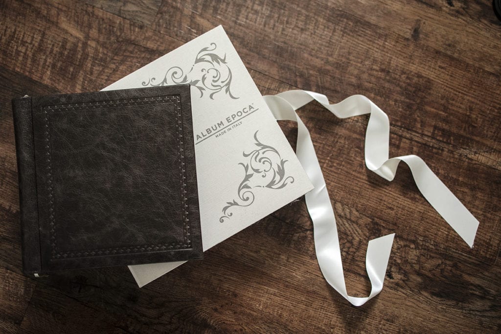 brown embossed leather Modern Ontario Wedding Album cover on top of Album Epoca box