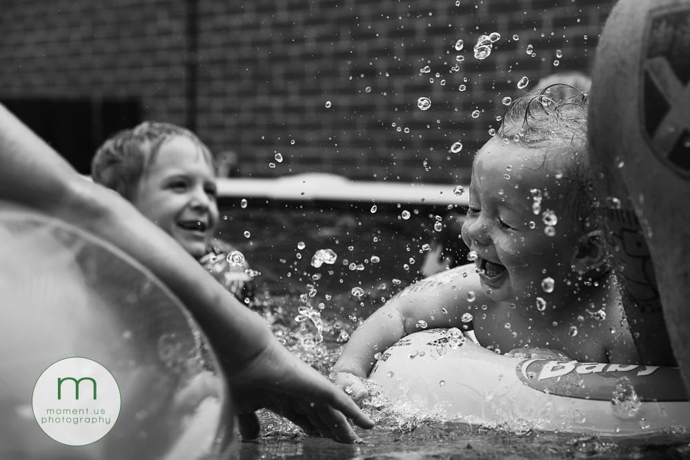 boy being splashed in face