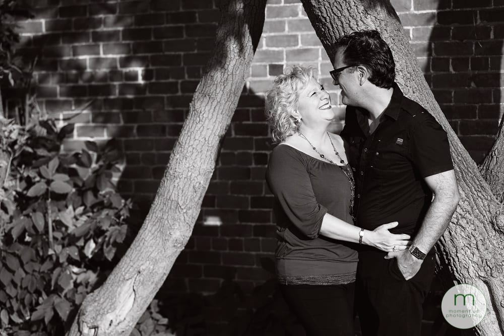 couple by brick wall