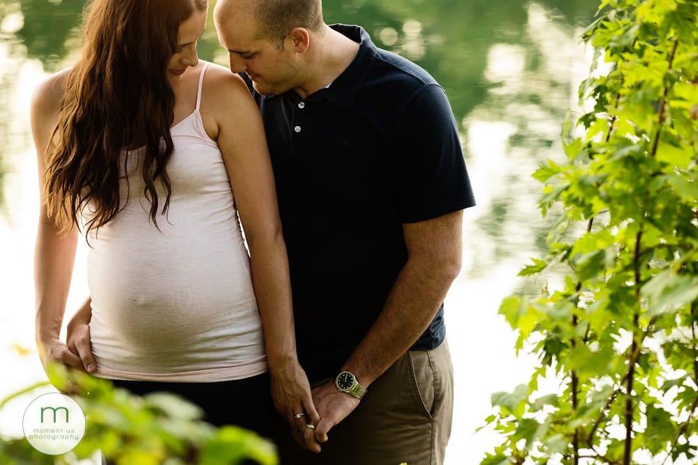 man kissing wife's shoulder