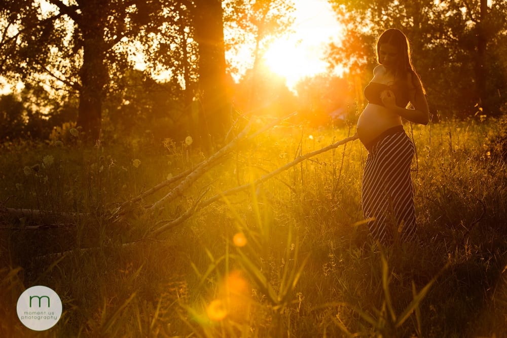 pregnant woman playing with hair