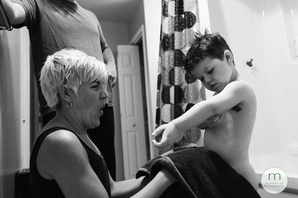 boy pulling off bandaid