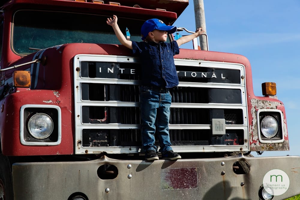 boy standing on truck
