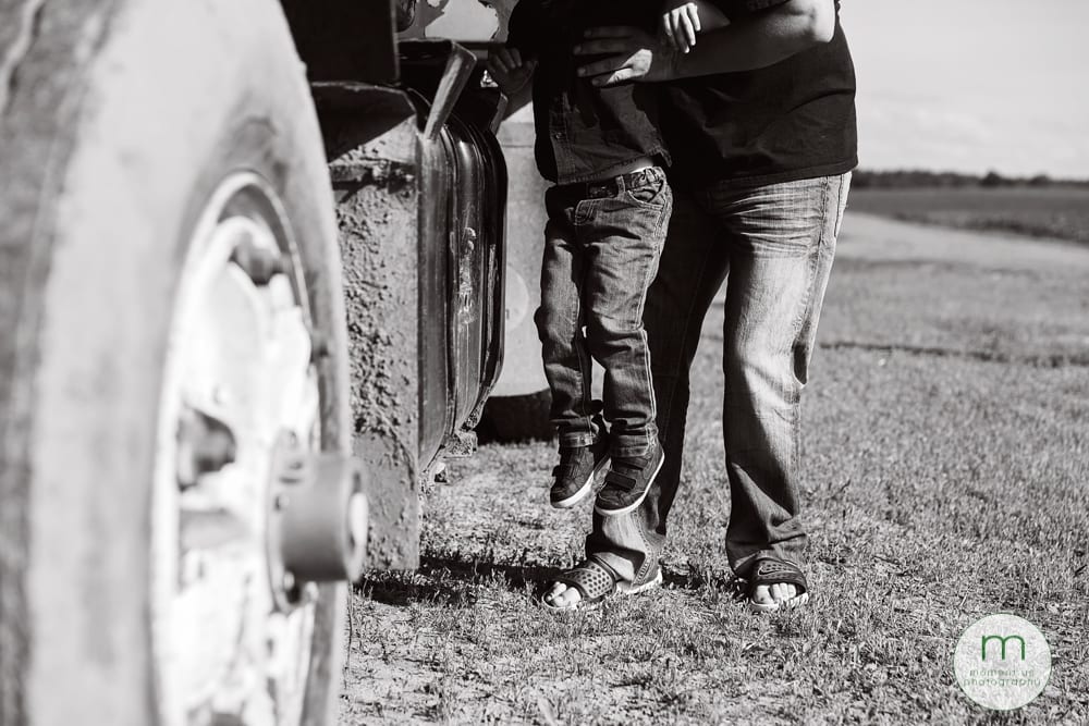 boy being lifted into truck