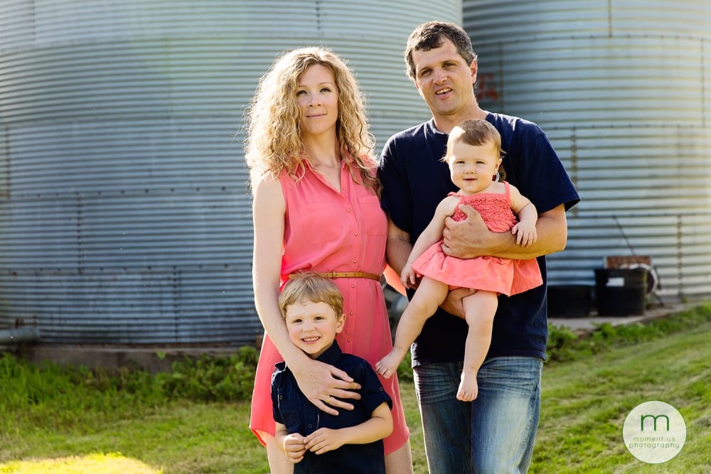 family in front of silo