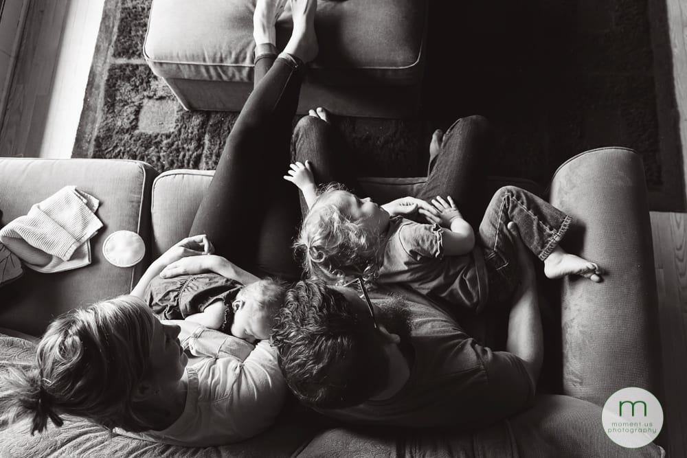 girl lying in mother's lap