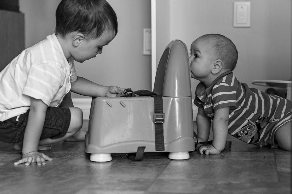 Cornwall brothers playing on kitchen floor