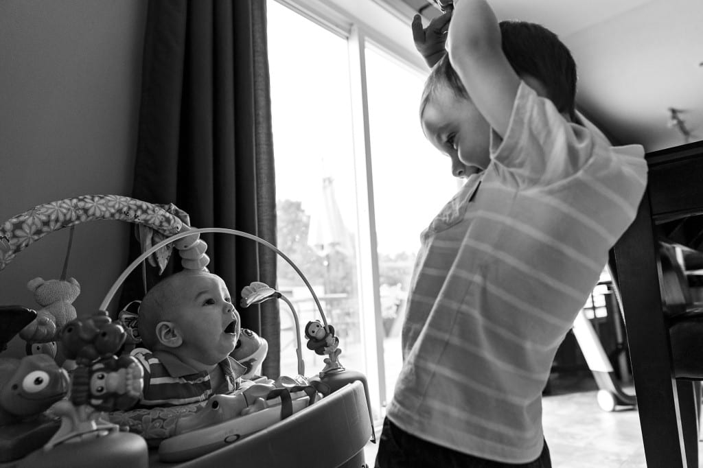 brothers playing peek-a-boo