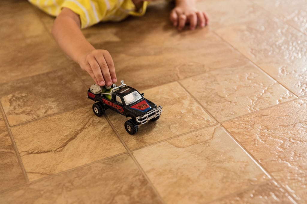 boy playing with truck