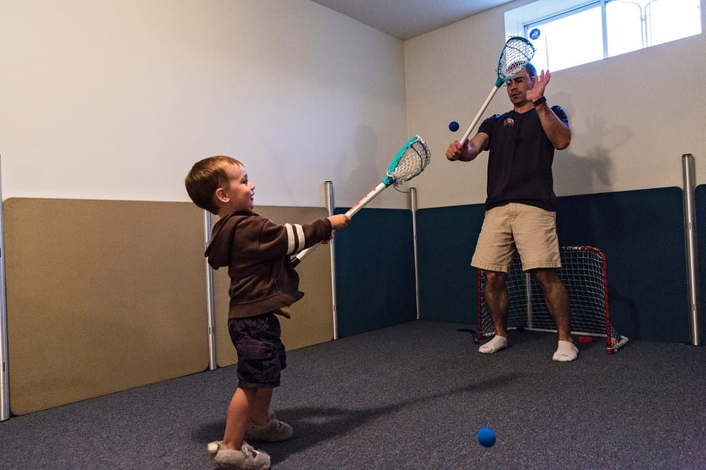 Cornwall boy and dad playing lacrosse