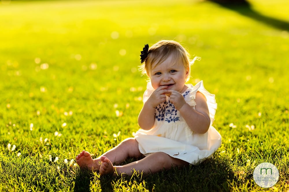 Cornwall child in blue dress on grass