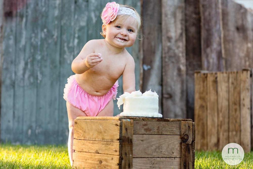 Cornwall child wearing pink diaper cover eating cake