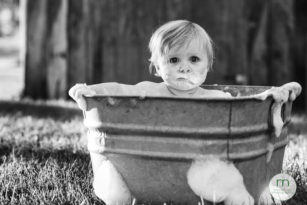 Cornwall child in tub making serious face