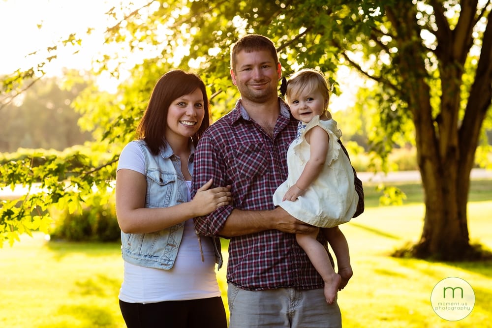 Cornwall family under trees with daughter