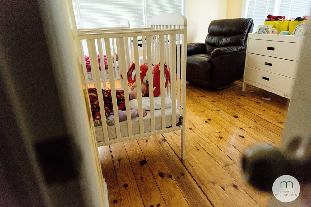 boy waking up in crib