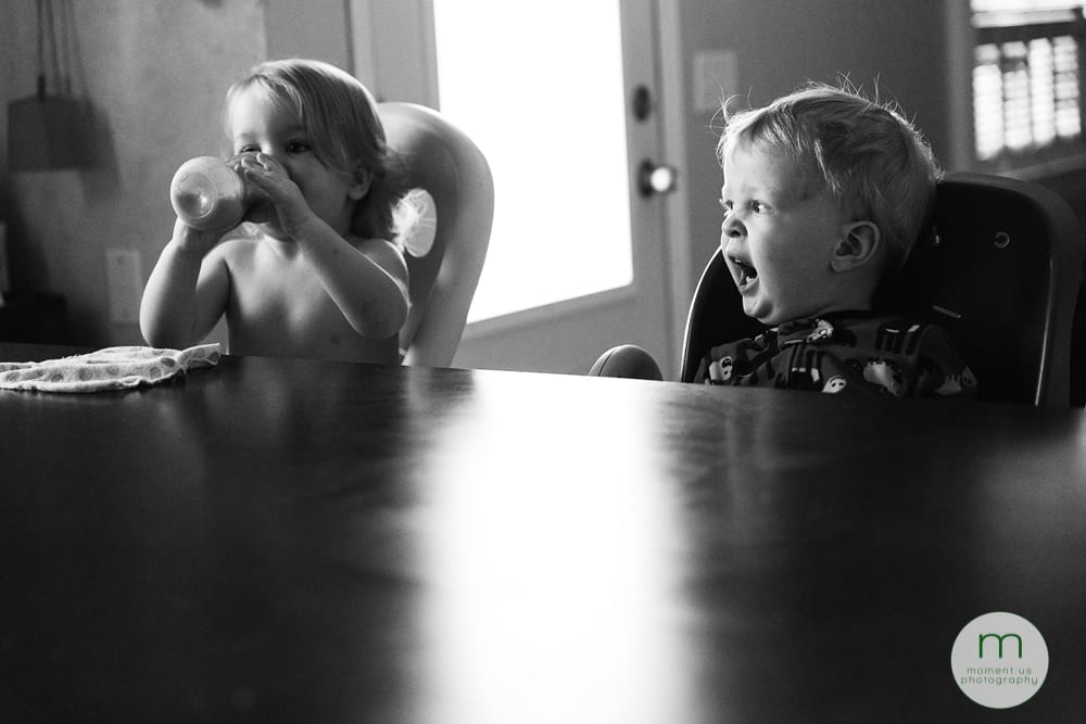 boy yawning in high chair
