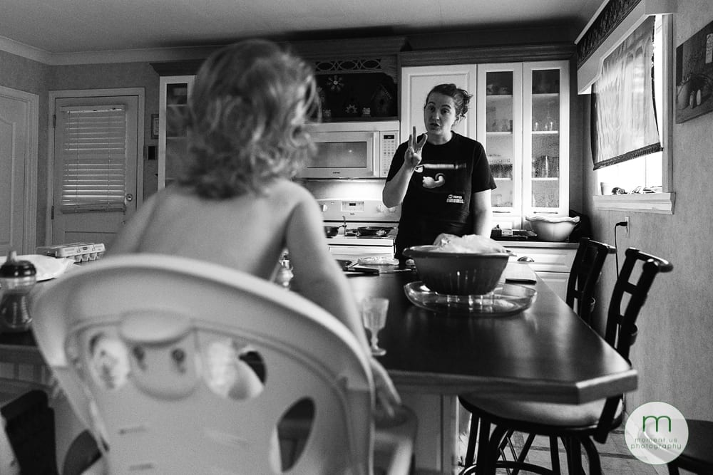 girl standing in highchair