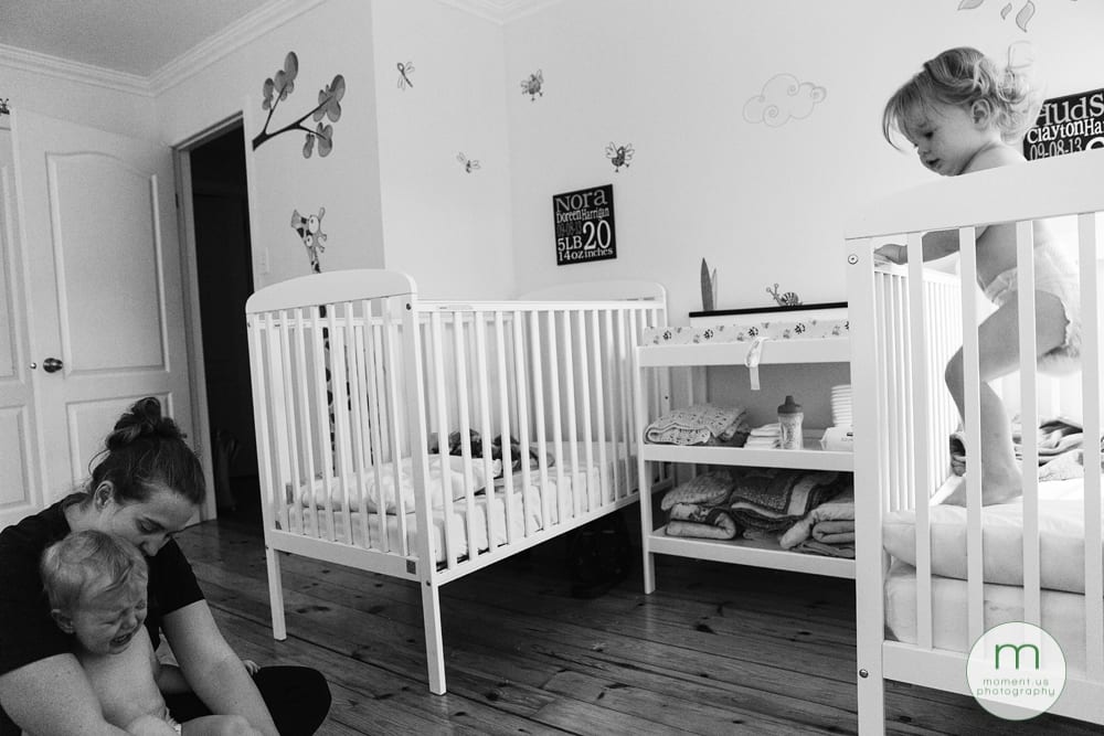 girl jumping in crib