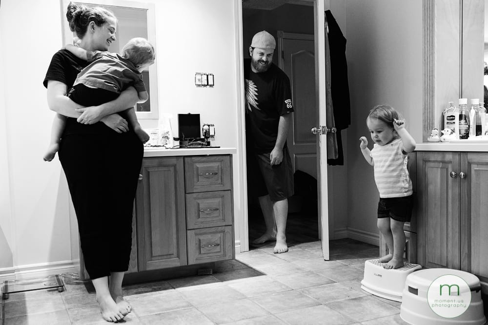 girl jumping off stool in bathroom