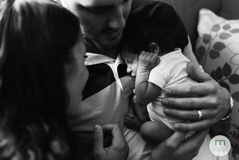 Cornwall mom and dad cuddling baby