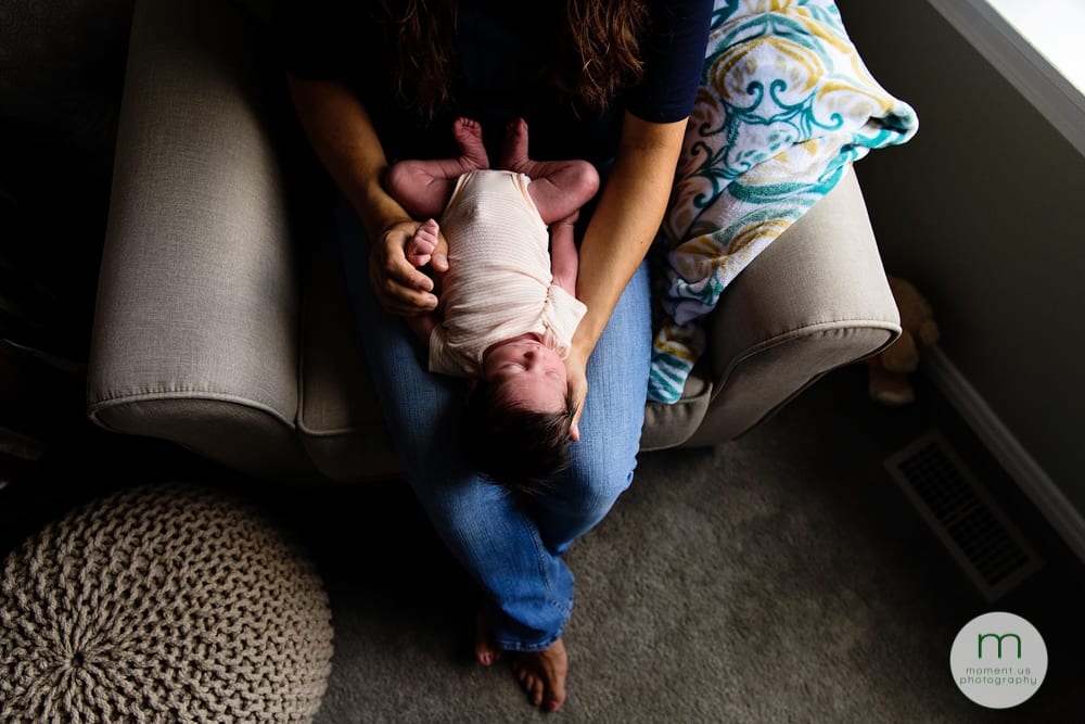 Cornwall mom with baby in nursery chair
