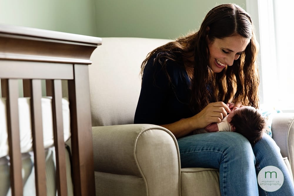 Cornwall mom smiling at newborn