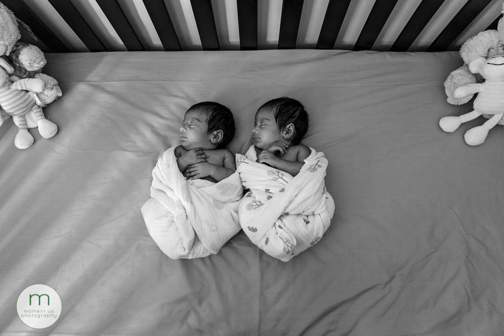 Brossard twin babies sleeping in crib