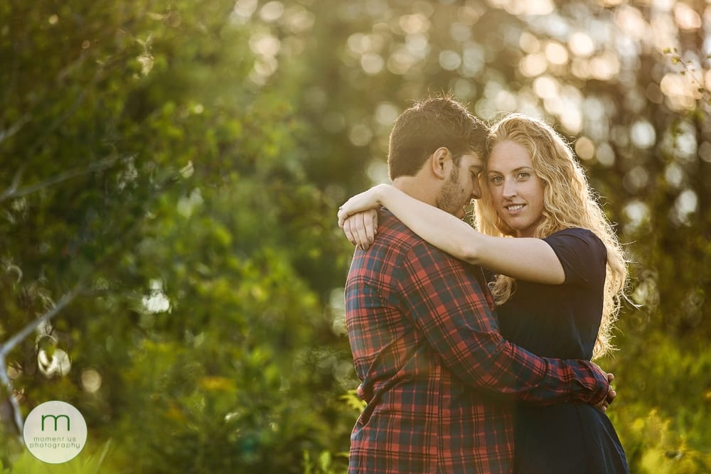 Woman and boyfriend in trees for Cornwall engagement session