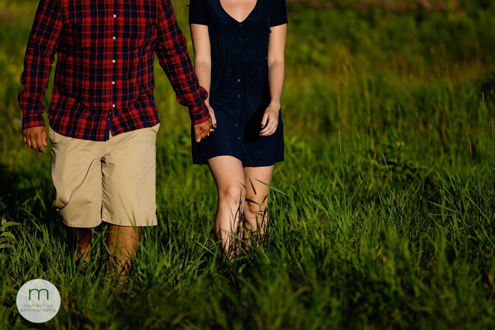Cornwall couple walking through grass