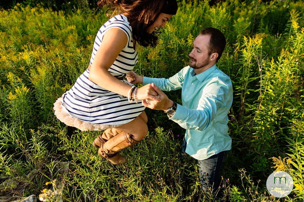 woman jumping off log