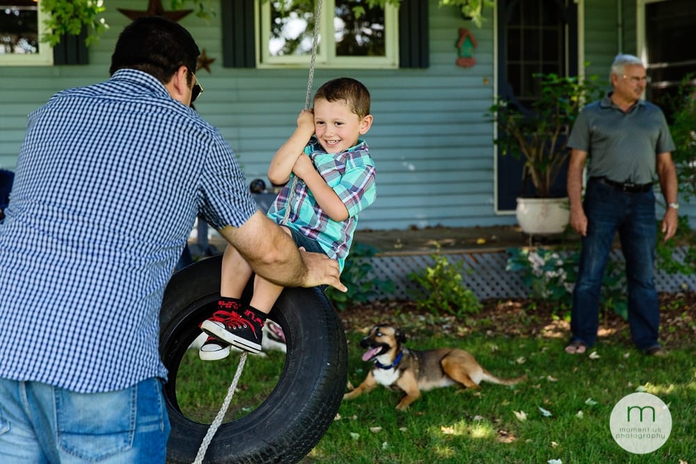 Cornwall family playing on tire swing