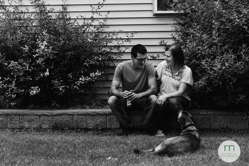 Cornwall couple sitting on rock wall