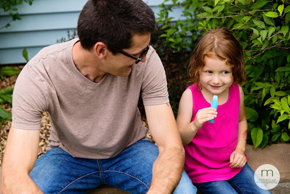 Cornwall girl eating popsicle with dad