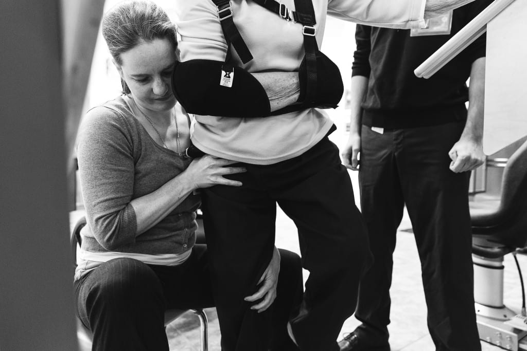 therapist pushing on knee