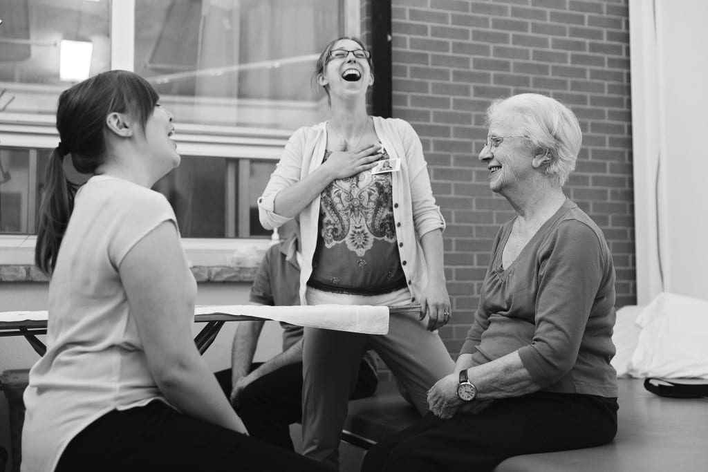 therapists laughing with patient
