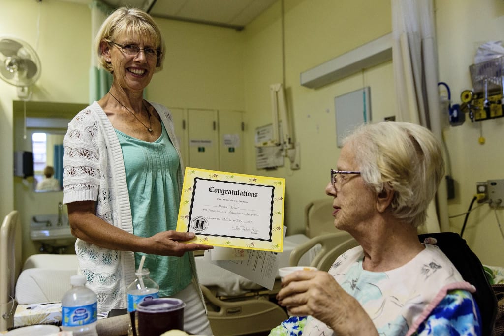 daughter holding certificate