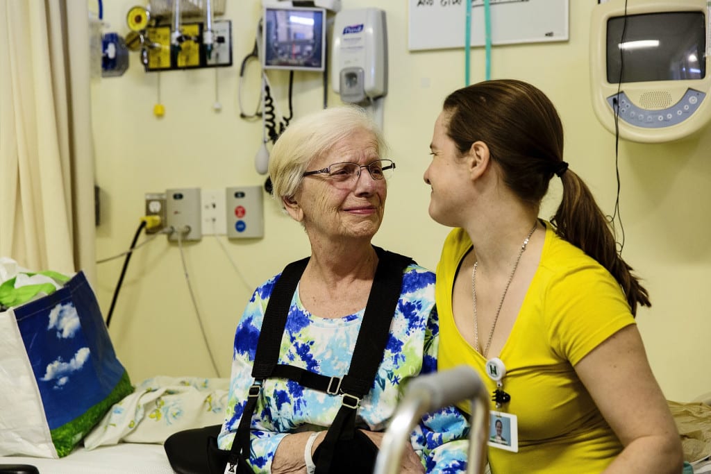 patient smiling at therapist while crying