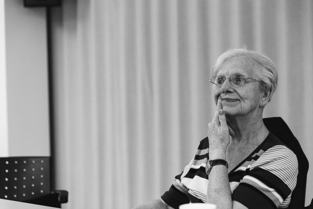 woman pushing one side of mouth