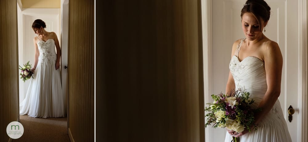 bride standing in hallway adjusting dress