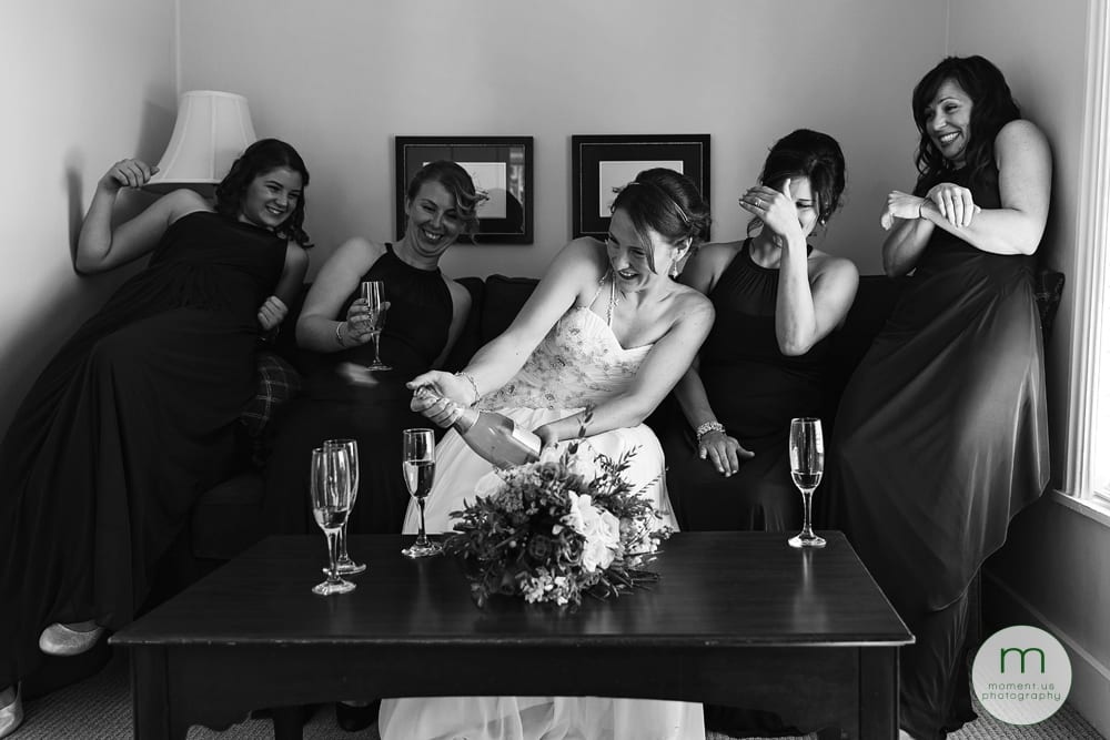 bride popping champagne cork