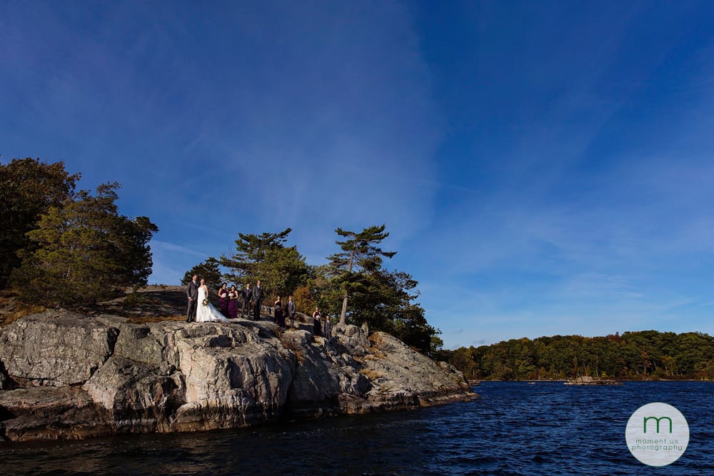 1000 Islands waterfront wedding party on rocky cliff