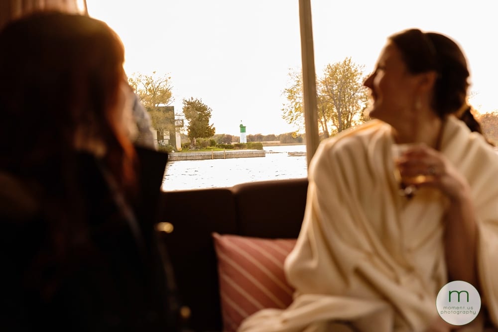 bride looking out boat window