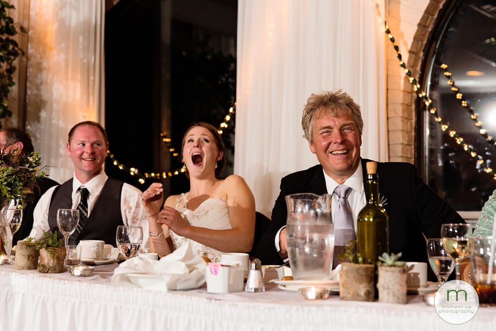 bride laughing during dinner